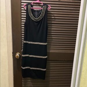 Chic Black Dress with Gold Chain Details